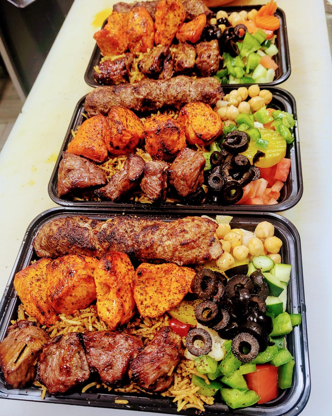 Mix Grill — lamb, chicken, and beef kabobs over rice